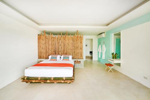 Katil atau katil-katil dalam bilik di Jai Tiki Retreat - Adult Only
