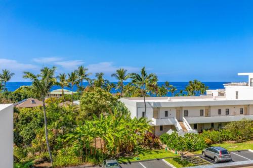 an aerial view of a building with the ocean in the background at Royal Sea Cliff Kona by OUTRIGGER in Kailua-Kona