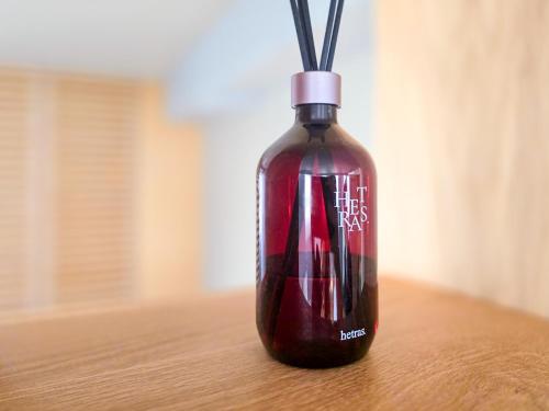 a bottle sitting on top of a table at Hotel STAY ARI Higashishinjuku in Tokyo