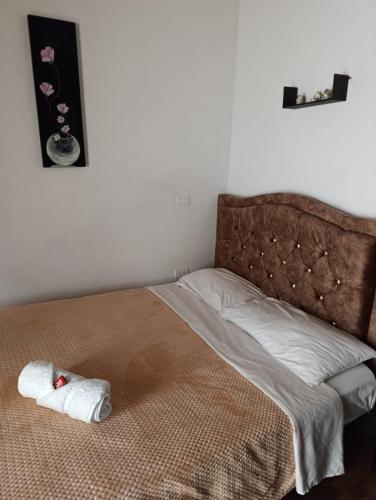 a bedroom with a bed with a towel on it at Hotel Casa Real Málaga Santander in Málaga