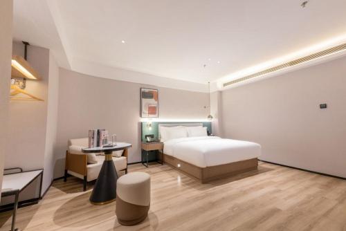 Katil atau katil-katil dalam bilik di Mehood EZZI Hotel Nanchang Bayi Square Ding Highway