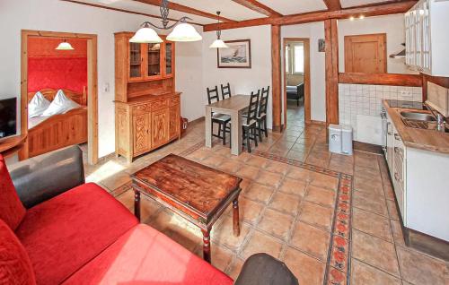 a living room with a couch and a table at Ferienwohnung Südmüritz in Vipperow
