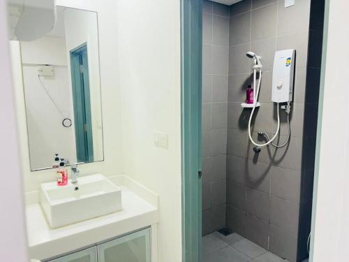 a bathroom with a sink and a shower at Mercu Summer Suites Kuala Lumpur Bukit Bintang By Classy in Kuala Lumpur