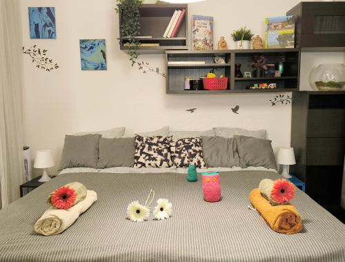 a bedroom with a bed with towels on it at Studio Viva - Cosy Flat in Budapest - Free Parking in Budapest