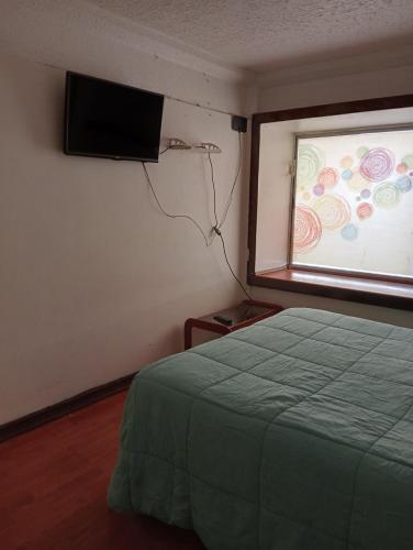 Letto o letti in una camera di Artemisa Propiedades