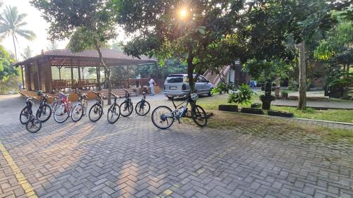 a group of bikes parked on a brick street at Anugrah Borobudur in Borobudur