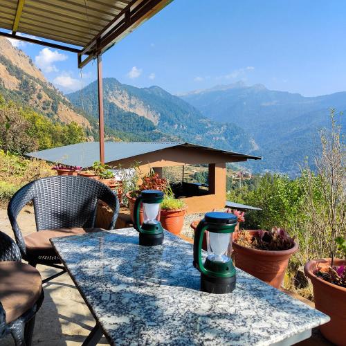 a table with a view of the mountains at Cafe Buransh in Sari