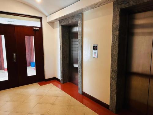 a hallway with two doors in a building at Hedges Court Residence -Lotus View - in 5th Floor in Colombo
