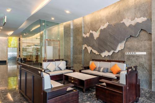 Ein Sitzbereich in der Unterkunft 厦门探索酒店 Discovery Hotel Xia Men