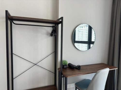 a door in a room with a table and a mirror at Cozy Urban Suites Georgetown View in Jelutong