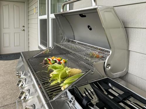 a grill with a bunch of vegetables on it at Soaring Spirit - Hot Tub, Pool Table, Arcades, 2 kitchens in Walla Walla
