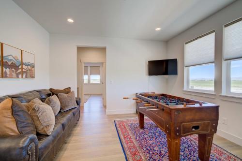 a living room with a couch and a foosball table at Spacious 3BR Home - Perfect Belgrade Getaway in Belgrade