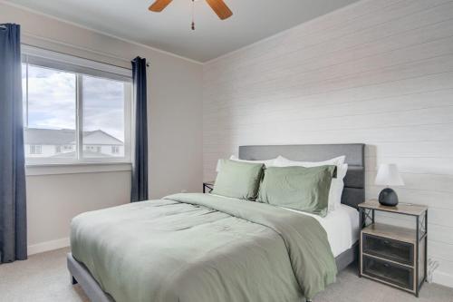 a white bedroom with a large bed with a window at Mountain View Haven in Belgrade in Belgrade