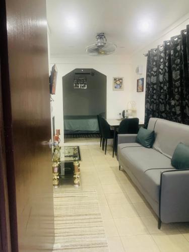 a living room with a couch and a table at Comfortable Accommodation in Lautoka