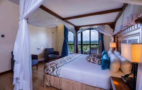 Postel nebo postele na pokoji v ubytování Ciala Resort Hotels In Kisumu