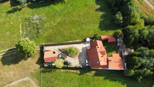 an overhead view of a house in a field at Doberek Noclegi w Beskidzie Niskim in Kobylanka