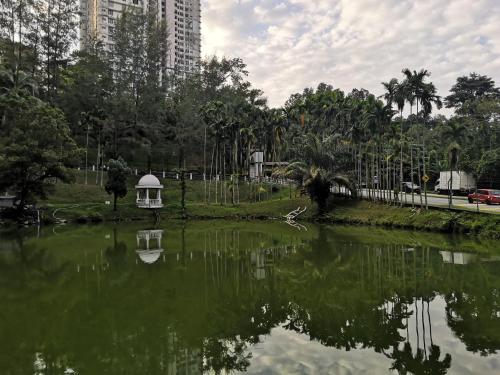 a pond with a white gazebo in a park at 2R 1B Venice Hill Cheras Room1 & Room2 in Cheras
