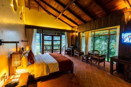 Postelja oz. postelje v sobi nastanitve Banbas Resort, Chitwan