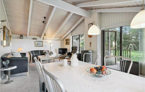 a living room with a table with a bowl of fruit on it at Holiday Home Gl Strandvej Henne X in Henne Strand