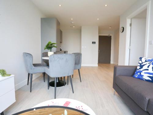 a living room with a couch and a table at Regent Road - 9th Floor, Pets Allowed, 24hr Shop - Pass the Keys in Manchester