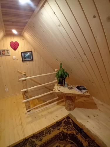 a room with a table in the middle of a room at Chatka w Dolinie in Witów