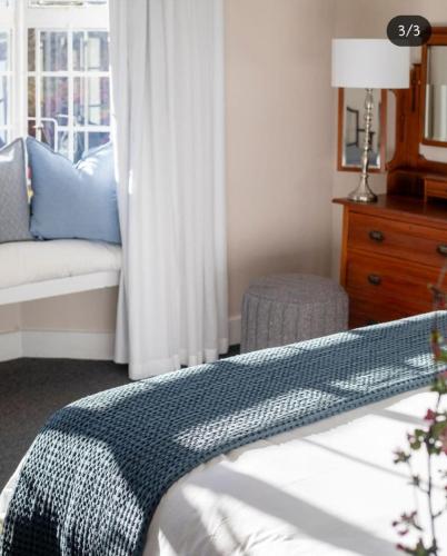Ένα ή περισσότερα κρεβάτια σε δωμάτιο στο Hydrangea Guest House