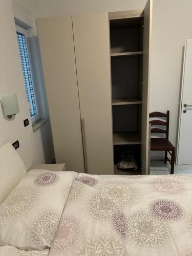 Ένα ή περισσότερα κρεβάτια σε δωμάτιο στο Funtana Appartements an der 1 Reihe vom Meer