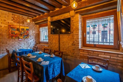 En restaurant eller et andet spisested på Hotel Tintoretto