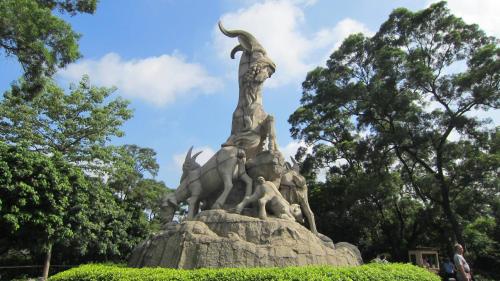 a statue in a park with trees in the background at Super Time Trendy Design Hotel Guangzhou Beijing Road Pedestrian Street Dafo Temple Branch in Guangzhou