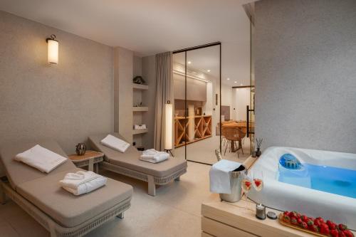 a bathroom with two beds and a bath tub at Villa Piano Turanj - Adriatic Luxury Villas in Turanj