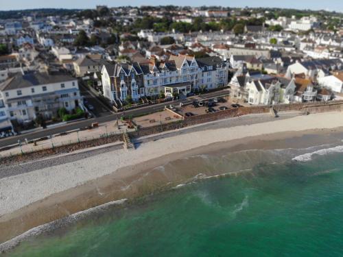an aerial view of a beach and buildings at Ommaroo Hotel in Saint Helier Jersey