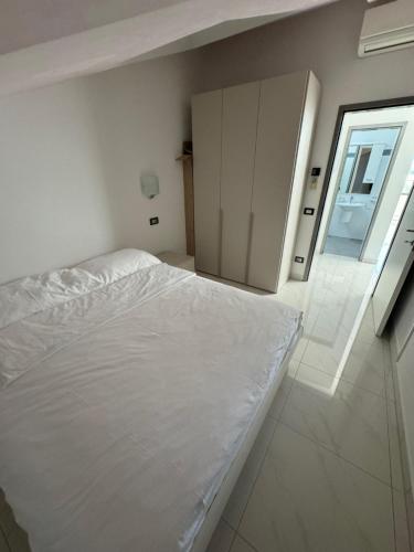 Ένα ή περισσότερα κρεβάτια σε δωμάτιο στο Funtana Appartements an der 1 Reihe vom Meer