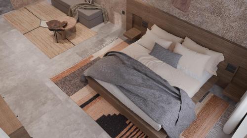 an overhead view of a bedroom with a bed and a table at F Fine Suites - Adults Only in Líndos