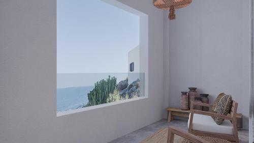 a room with a picture of the ocean on the wall at F Fine Suites - Adults Only in Líndos