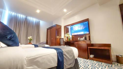 Katil atau katil-katil dalam bilik di Golden Dune Residential Unit - Almalaz