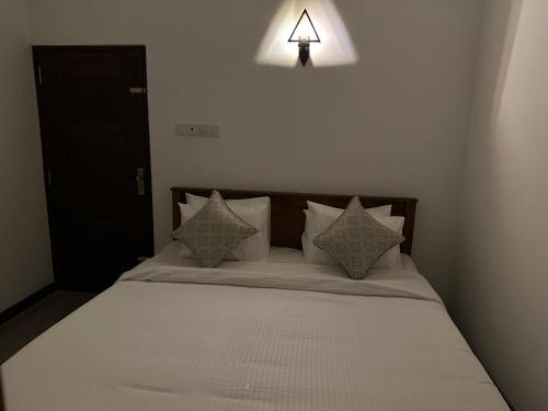 Ένα ή περισσότερα κρεβάτια σε δωμάτιο στο M&M Villa