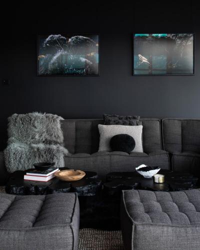 a living room with a couch and a table at Siren Tasmania in White Beach