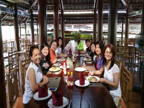 a group of women sitting at a table in a restaurant at Cat Tien Jungle Lodge in Cat Tien
