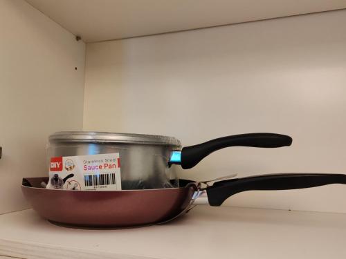 a pan sitting on top of a stove with a pot at No Other Fee #Swiss Garden Residences by The Boston House #Bukit Bintang in Kuala Lumpur