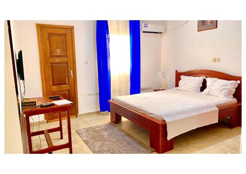 Llit o llits en una habitació de Le Sable