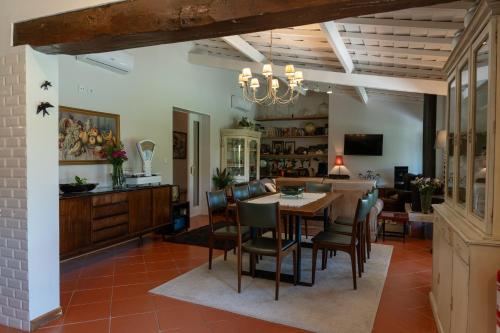 a dining room with a table and chairs at Casas Viriatus in Paredes de Coura