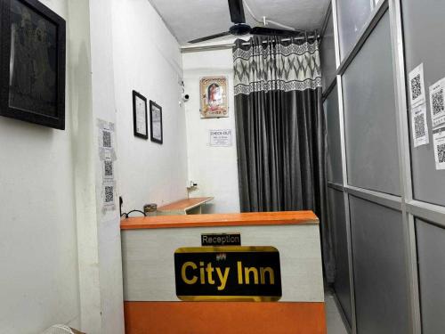 a cityim office with a cityim sign on the counter at Super Hotel O City Inn in Ayodhya