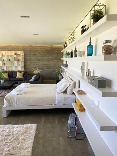 a bedroom with a bed and a living room at Mountain View Villa - Heated Big Pool-Quinta da BellaVista in Santarém