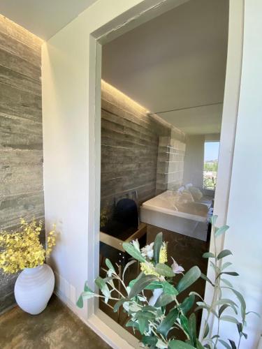 a room with a window with a plant in it at Mountain View Villa - Heated Big Pool-Quinta da BellaVista in Santarém