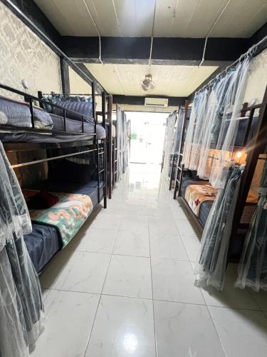 a hallway with bunk beds in a room at BT @ Haadrin in Haad Rin