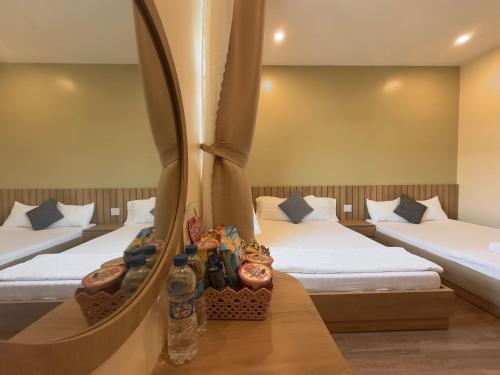 Ένα ή περισσότερα κρεβάτια σε δωμάτιο στο Gia An Hung Guest House