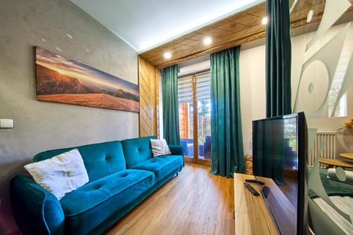 Aparthotel Giewontにあるテレビまたはエンターテインメントセンター