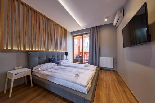 Aparthotel Giewontにあるベッド