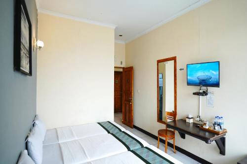TV a/nebo společenská místnost v ubytování Saung Balibu Hotel