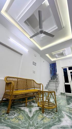 two benches in a room with a ceiling at The Chalet - Cozy Villa with Mini Pool, near Eden Blue Flag Beach, Pondicherry - JR Groups in Puducherry